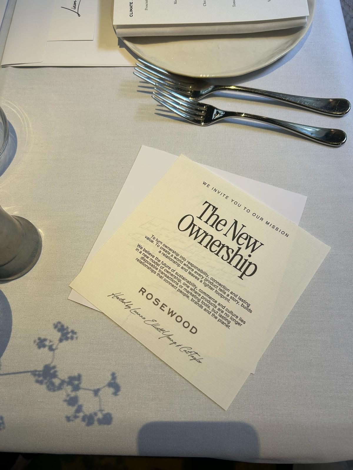The New Ownership invitation card on the dinner table at Rosewood London